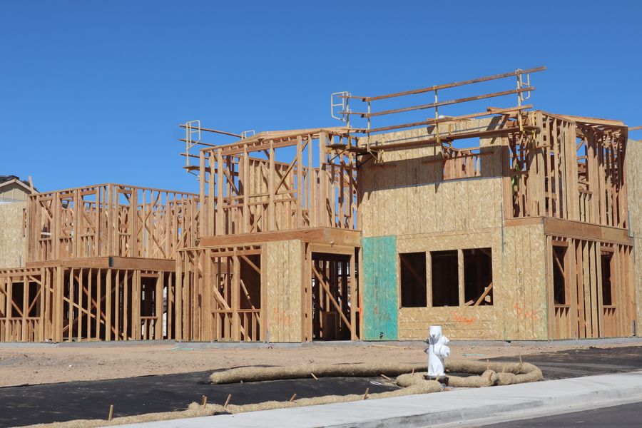 New home under construction with wood framing complete