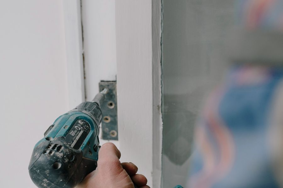 Drill fastening hardware on a window frame